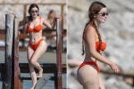 Demi Rose flaunts her famous curves in an orange bikini 6 demi twin jk