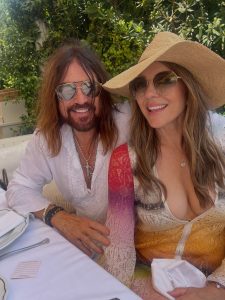 Elizabeth Hurley Wears a Tiny Teal Bikini Held by Gold Chains