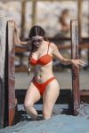 Demi Rose flaunts her famous curves in an orange bikini 8 exclusive ibiza spain demi rose 1099683789