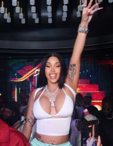 Cardi B turns heads in a plunging white top