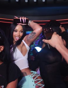 Cardi B turns heads in a plunging white top