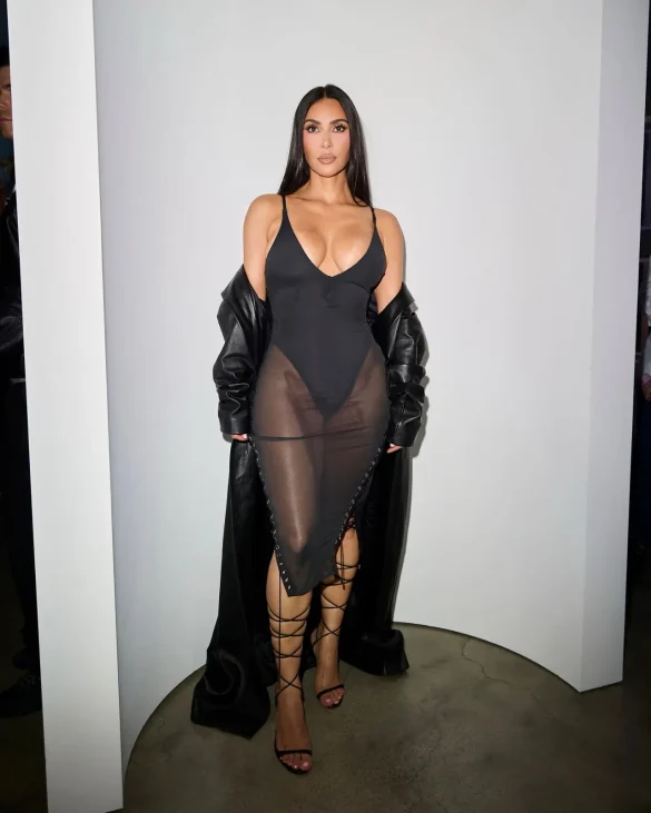 kim kardashian in a sheer black dress and leather coat leaves the update pop up on melrose 1