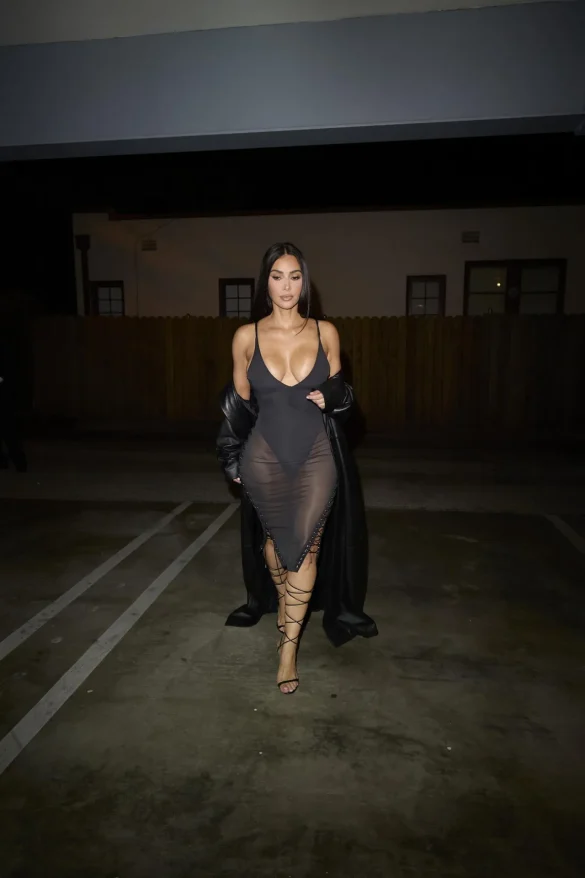 kim kardashian in a sheer black dress and leather coat leaves the update pop up on melrose 2