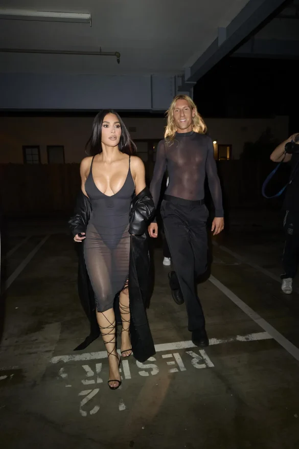 kim kardashian in a sheer black dress and leather coat leaves the update pop up on melrose 3